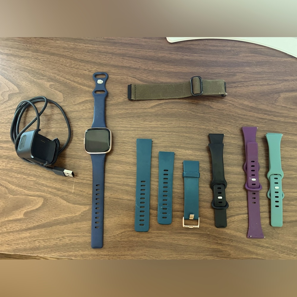 Fitbit Versa2 w/ charger and 6 bands.